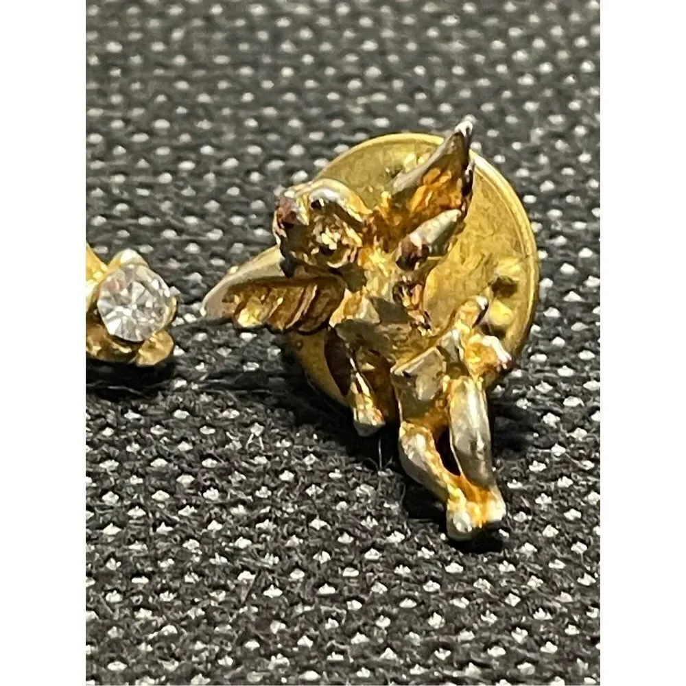 Two cherub pins￼